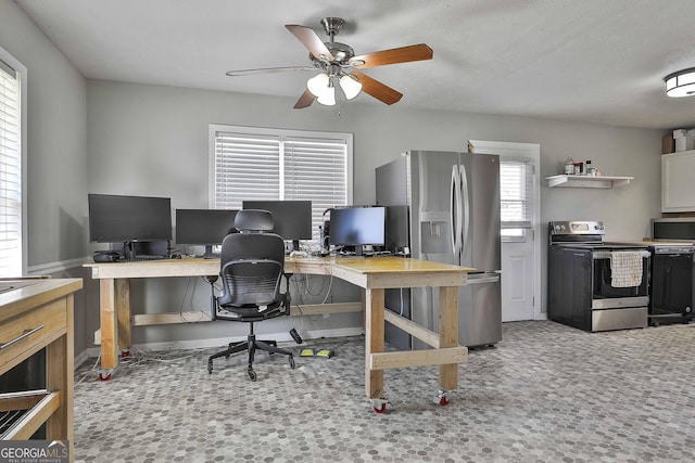 office area with light carpet and a ceiling fan