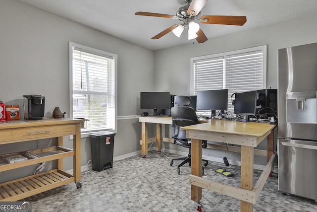 office featuring baseboards and a ceiling fan