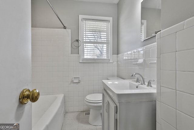 bathroom with tile patterned flooring, a washtub, toilet, tile walls, and a shower