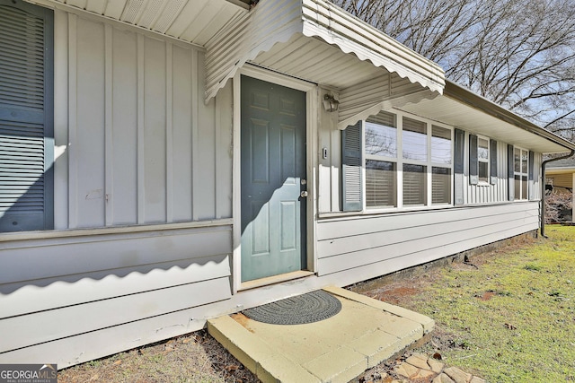 entrance to property featuring board and batten siding