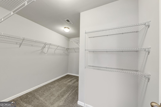 walk in closet with carpet floors and visible vents