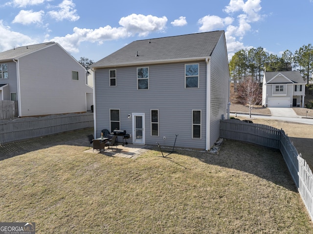 back of house with a fenced backyard, a yard, and a patio