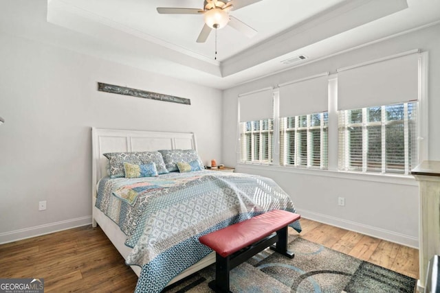 125 Grand Cir, Jasper, GA 30143 - bedroom featuring a raised ceiling, ornamental molding, wood finished floors, baseboards, and ceiling fan