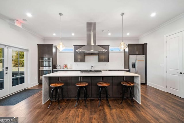 125 Grand Cir, Jasper, GA 30143 - kitchen featuring appliances with stainless steel finishes, island range hood, light countertops, a spacious island, and dark wood-style flooring