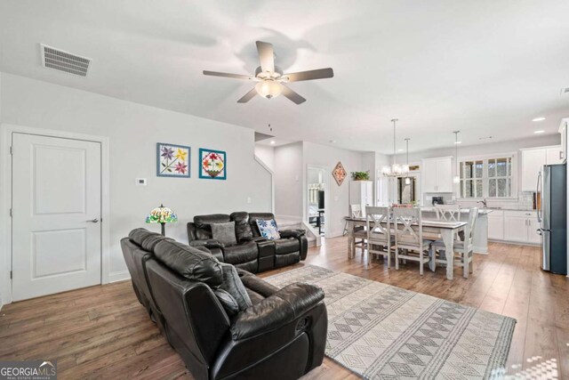 125 Grand Cir, Jasper, GA 30143 - living area featuring ceiling fan, light wood-style flooring, a chandelier, and recessed lighting