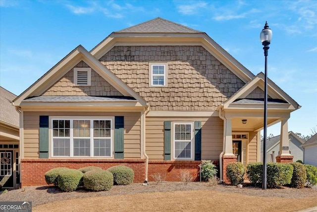 view of front of home featuring brick siding