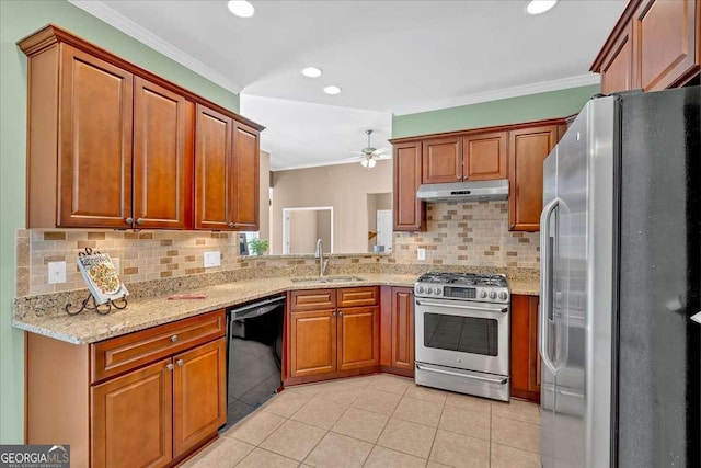 kitchen with brown cabinets, crown molding, appliances with stainless steel finishes, a sink, and under cabinet range hood