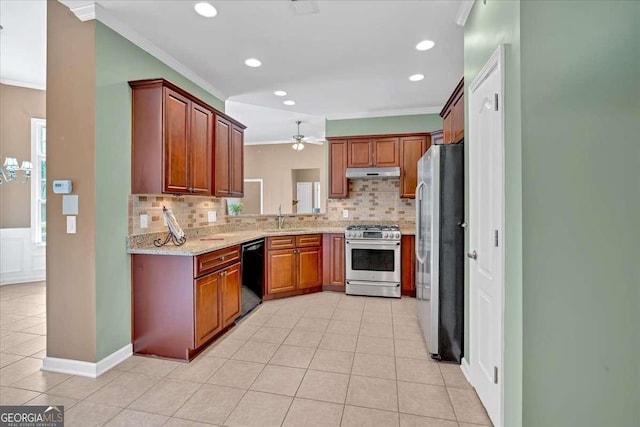 kitchen with stainless steel appliances, ornamental molding, under cabinet range hood, and a sink