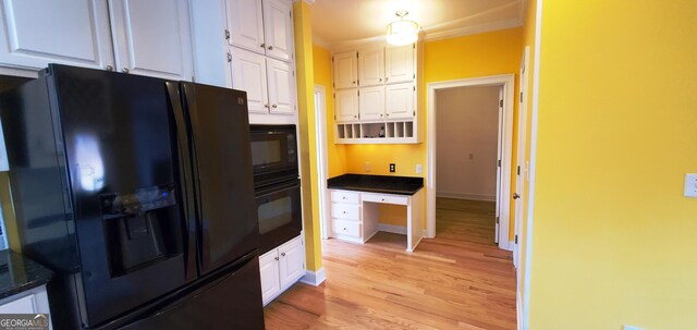 2899 Greystone Cv N, Atlanta, GA 30341 - kitchen featuring black appliances, white cabinets, light wood-style floors, crown molding, and baseboards