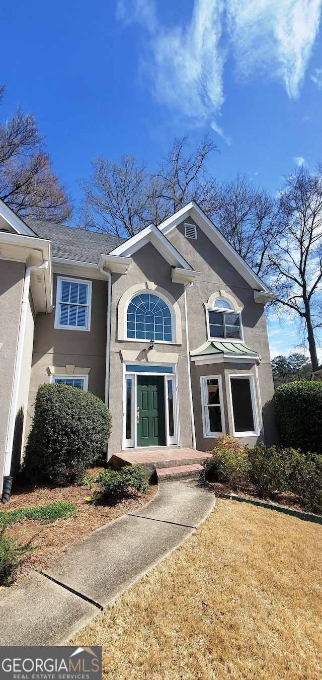 view of front of property featuring stucco siding