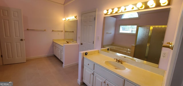 2899 Greystone Cv N, Atlanta, GA 30341 - full bath featuring two vanities, a stall shower, a bath, and baseboards