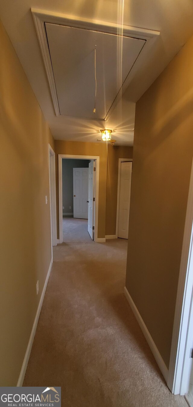 2899 Greystone Cv N, Atlanta, GA 30341 - hallway featuring attic access, light carpet, and baseboards