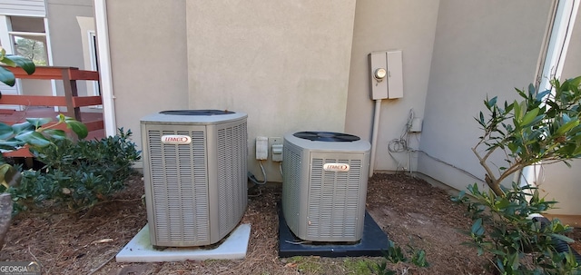 2899 Greystone Cv N, Atlanta, GA 30341 - exterior view of cooling unit, stucco siding, and electric meter