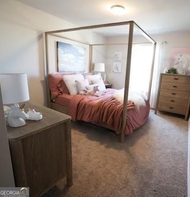 bedroom featuring light colored carpet