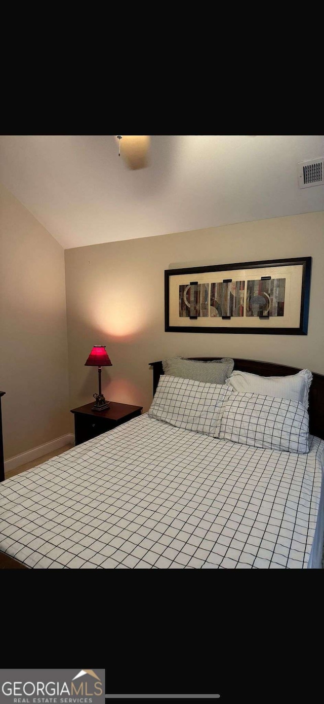 bedroom featuring visible vents and baseboards