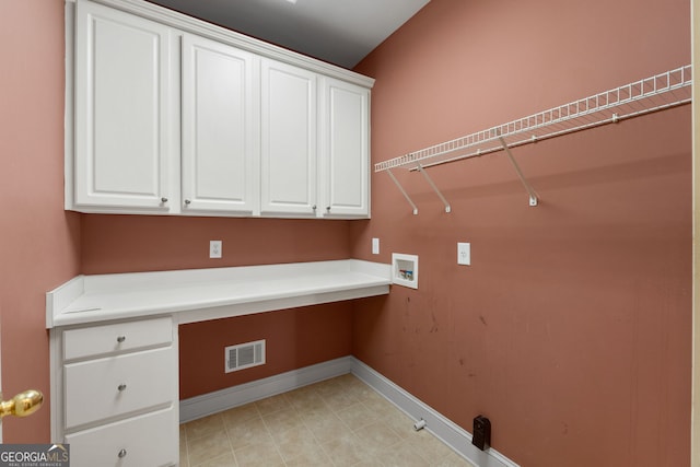 clothes washing area with cabinet space, baseboards, visible vents, gas dryer hookup, and hookup for a washing machine