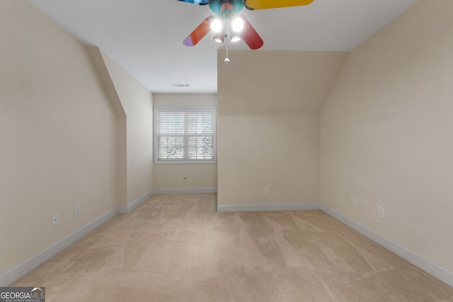 bonus room featuring a ceiling fan, visible vents, light carpet, and baseboards