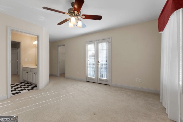 unfurnished bedroom with light carpet, access to exterior, baseboards, and a ceiling fan