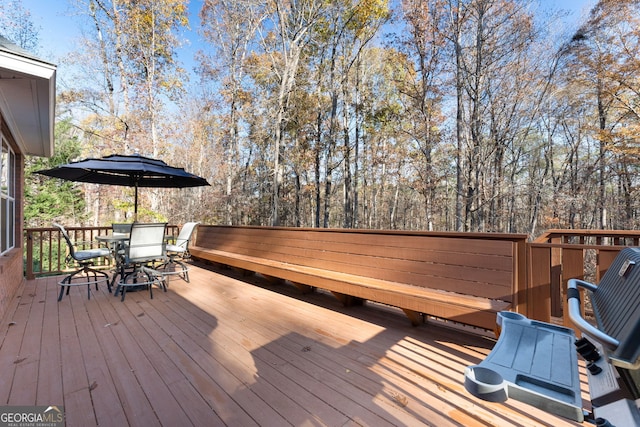 deck with outdoor dining area