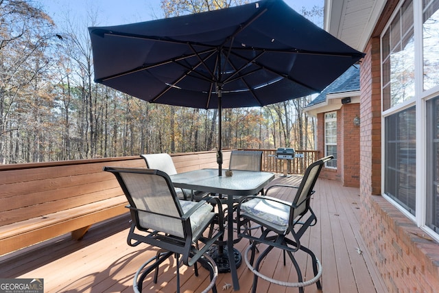 wooden deck with outdoor dining space