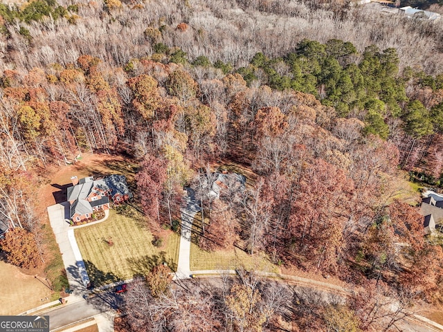 bird's eye view featuring a forest view