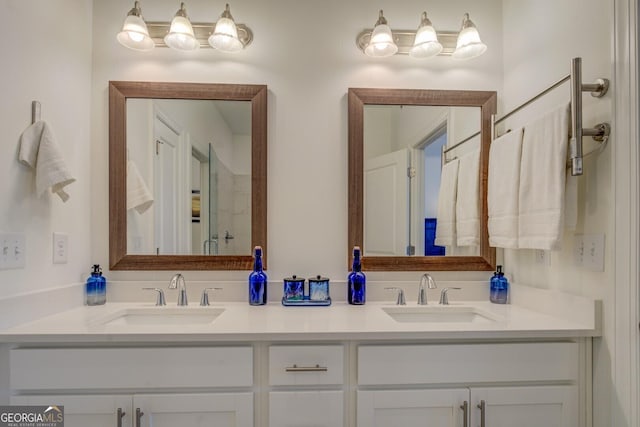 full bathroom featuring double vanity and a sink