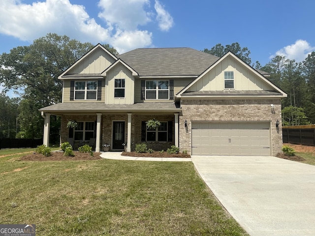 craftsman-style home featuring board and batten siding, concrete driveway, brick siding, and a front lawn