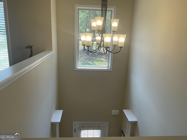 unfurnished dining area with a chandelier