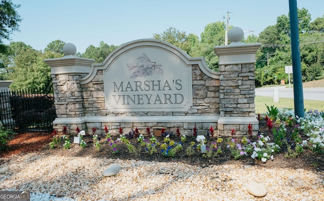 community sign with fence