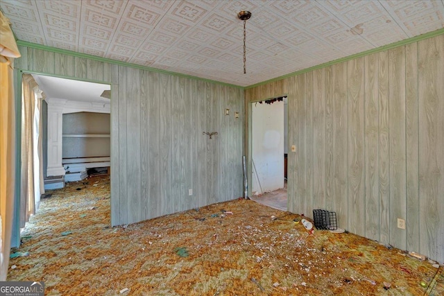 spare room with an ornate ceiling