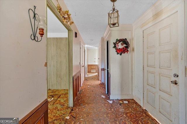 corridor featuring ornamental molding