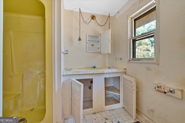 full bath featuring a shower and vanity