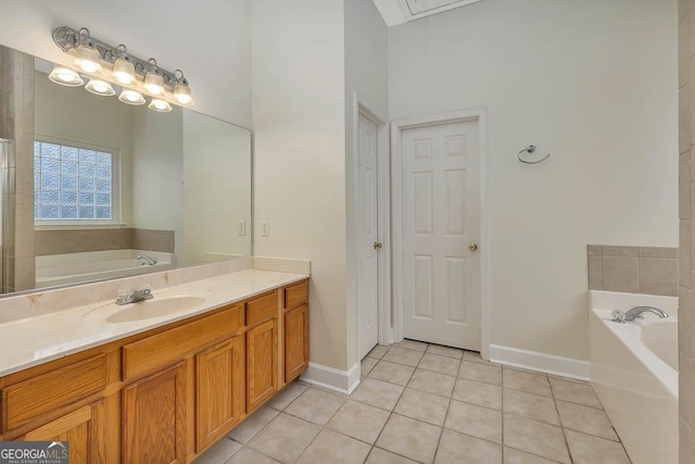 bathroom with tile patterned floors, baseboards, a bath, and vanity