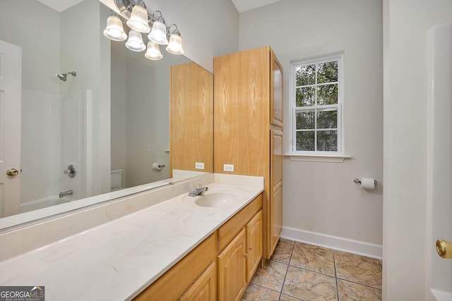 full bathroom with tub / shower combination, baseboards, a chandelier, toilet, and vanity