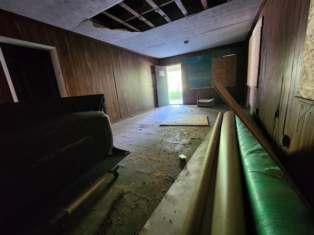 interior space featuring wooden walls