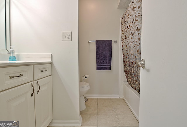 full bathroom with toilet, tile patterned flooring, baseboards, and vanity