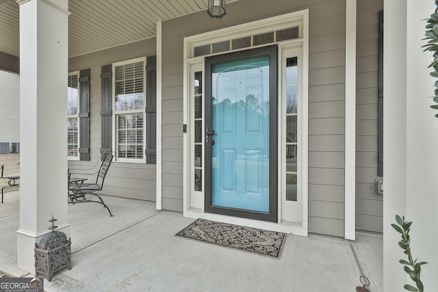 doorway to property with a porch