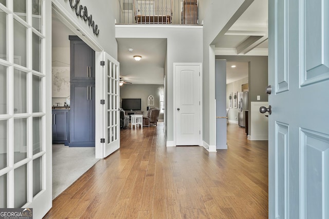 114 Austin Storey Cir, Newnan, GA 30263 - foyer with french doors, wood finished floors, and baseboards
