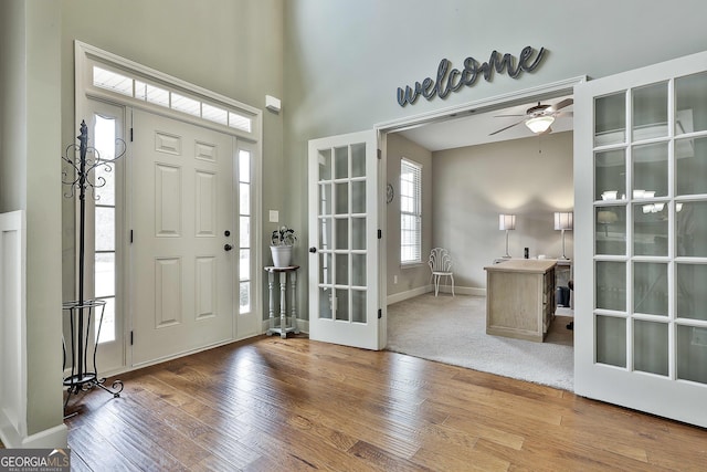 114 Austin Storey Cir, Newnan, GA 30263 - foyer with french doors, wood finished floors, ceiling fan, and baseboards