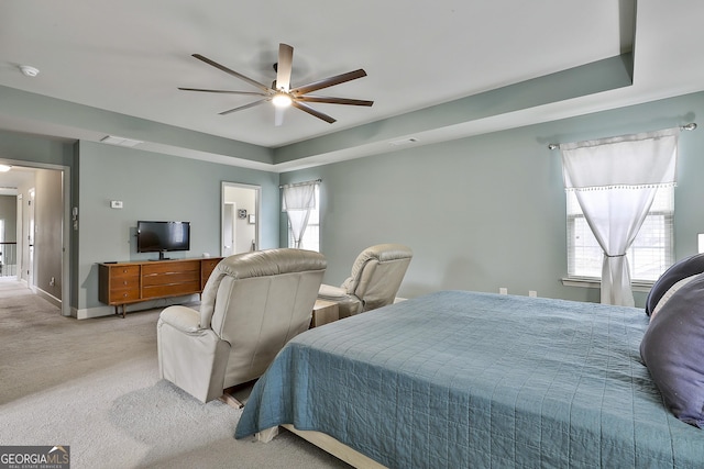 bedroom featuring visible vents, light carpet, multiple windows, and baseboards