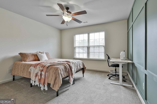 bedroom featuring visible vents, baseboards, and light colored carpet