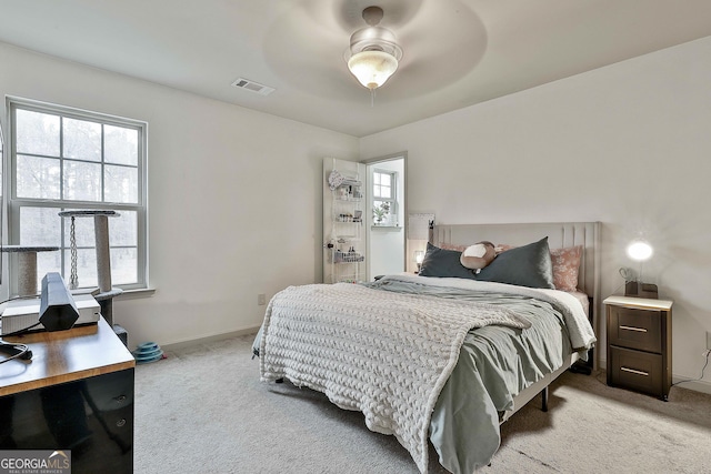 114 Austin Storey Cir, Newnan, GA 30263 - bedroom featuring carpet floors, multiple windows, and a ceiling fan