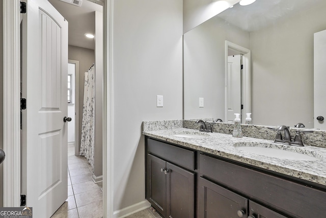 114 Austin Storey Cir, Newnan, GA 30263 - full bath with tile patterned floors, double vanity, and baseboards