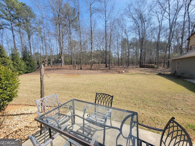 view of yard featuring outdoor dining area