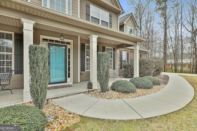 entrance to property featuring a porch