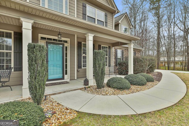 114 Austin Storey Cir, Newnan, GA 30263 - doorway to property featuring a porch