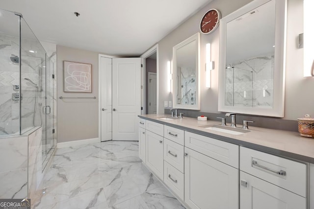 full bath featuring double vanity, marble finish floor, a marble finish shower, and a sink