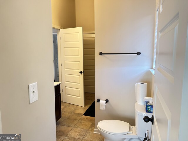 bathroom featuring toilet and vanity