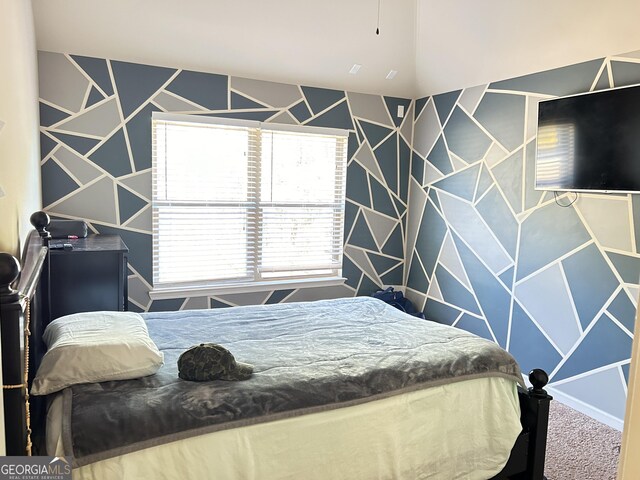 carpeted bedroom featuring wallpapered walls and an accent wall