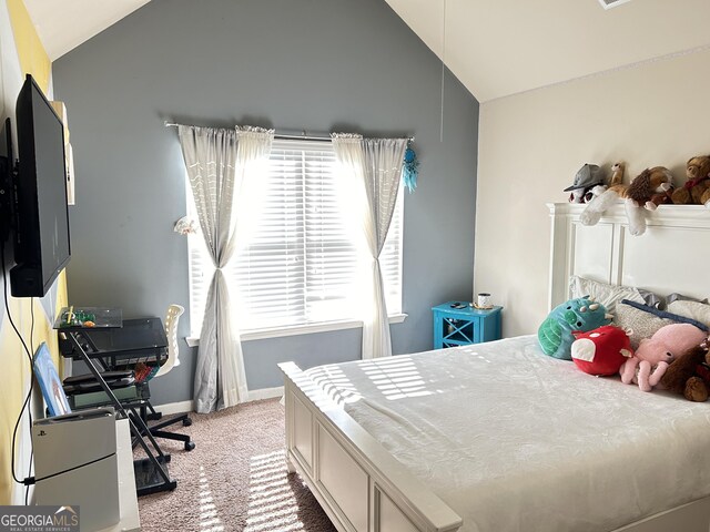bedroom with baseboards, lofted ceiling, and light carpet